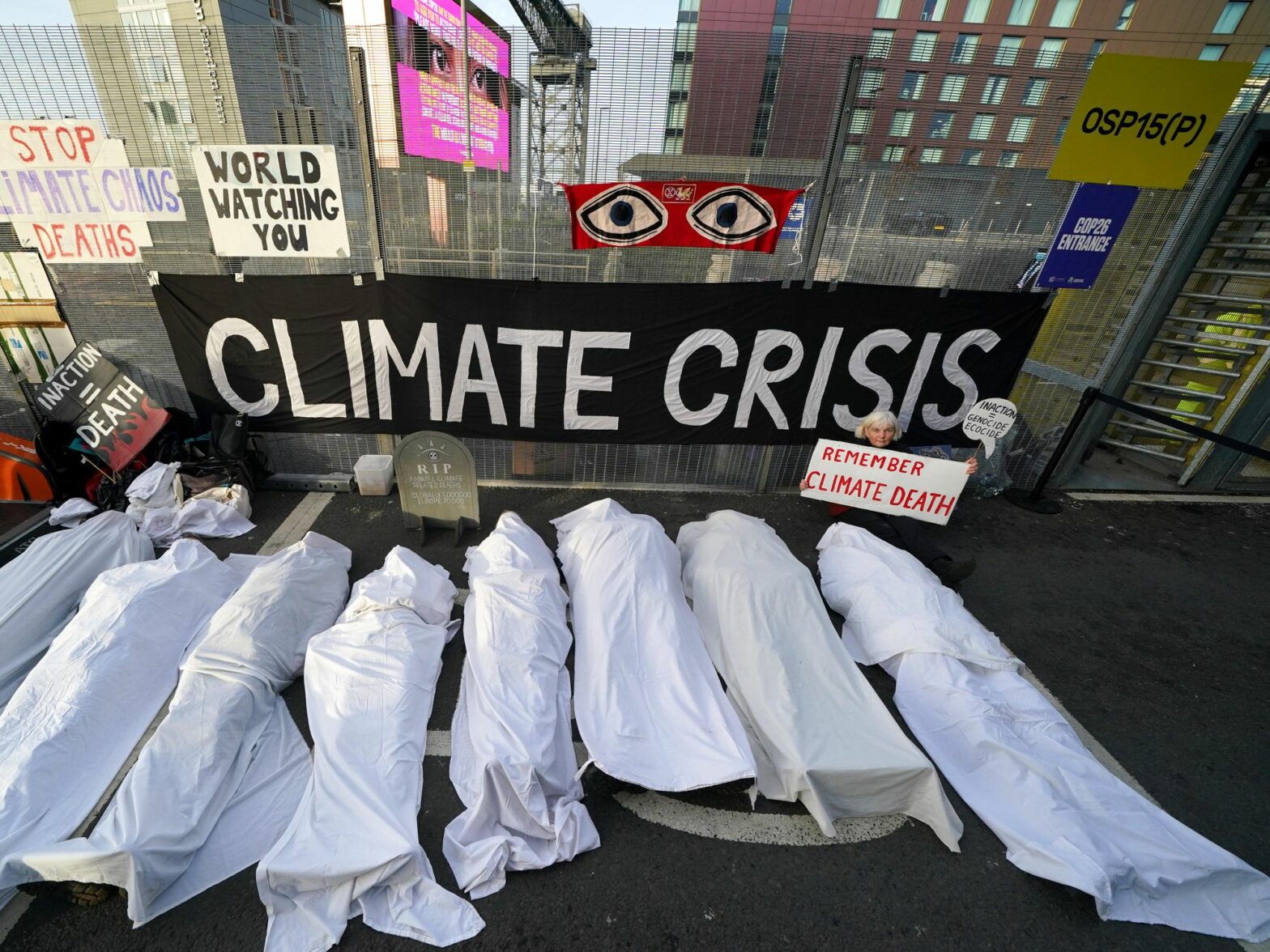As the COP26 summit in Glasgow, UK, draws to a close, activists dressed as shrouded bodies standing for the victims of climate change, as part of a protest on Nov. 11.