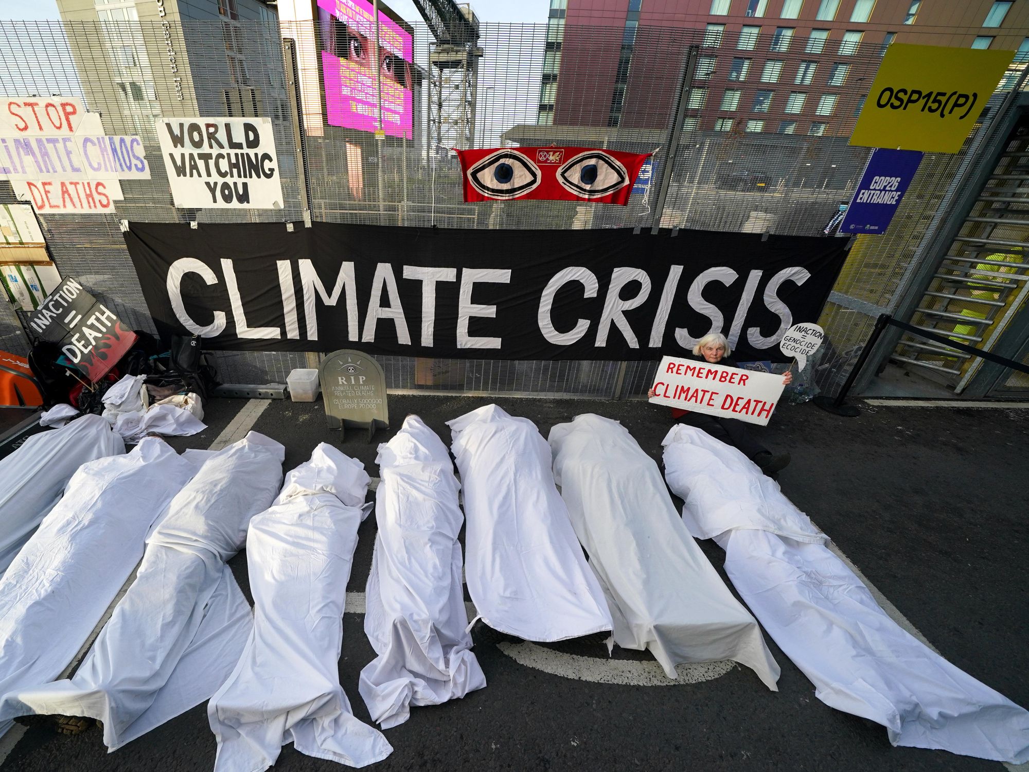 As the COP26 summit in Glasgow, UK, draws to a close, activists dressed as shrouded bodies standing for the victims of climate change, as part of a protest on Nov. 11.