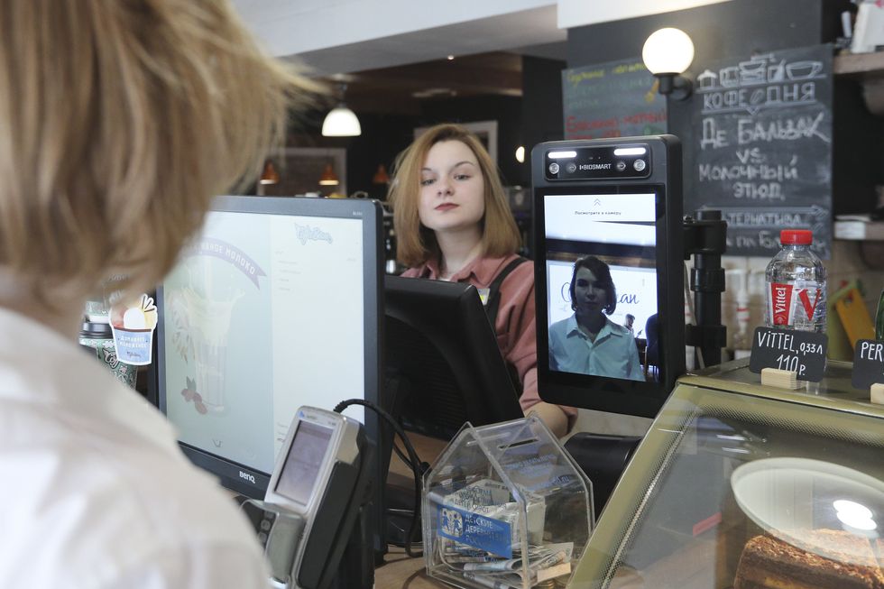 At a cafe in Moscow which uses a biometric facial recognition system for payments.