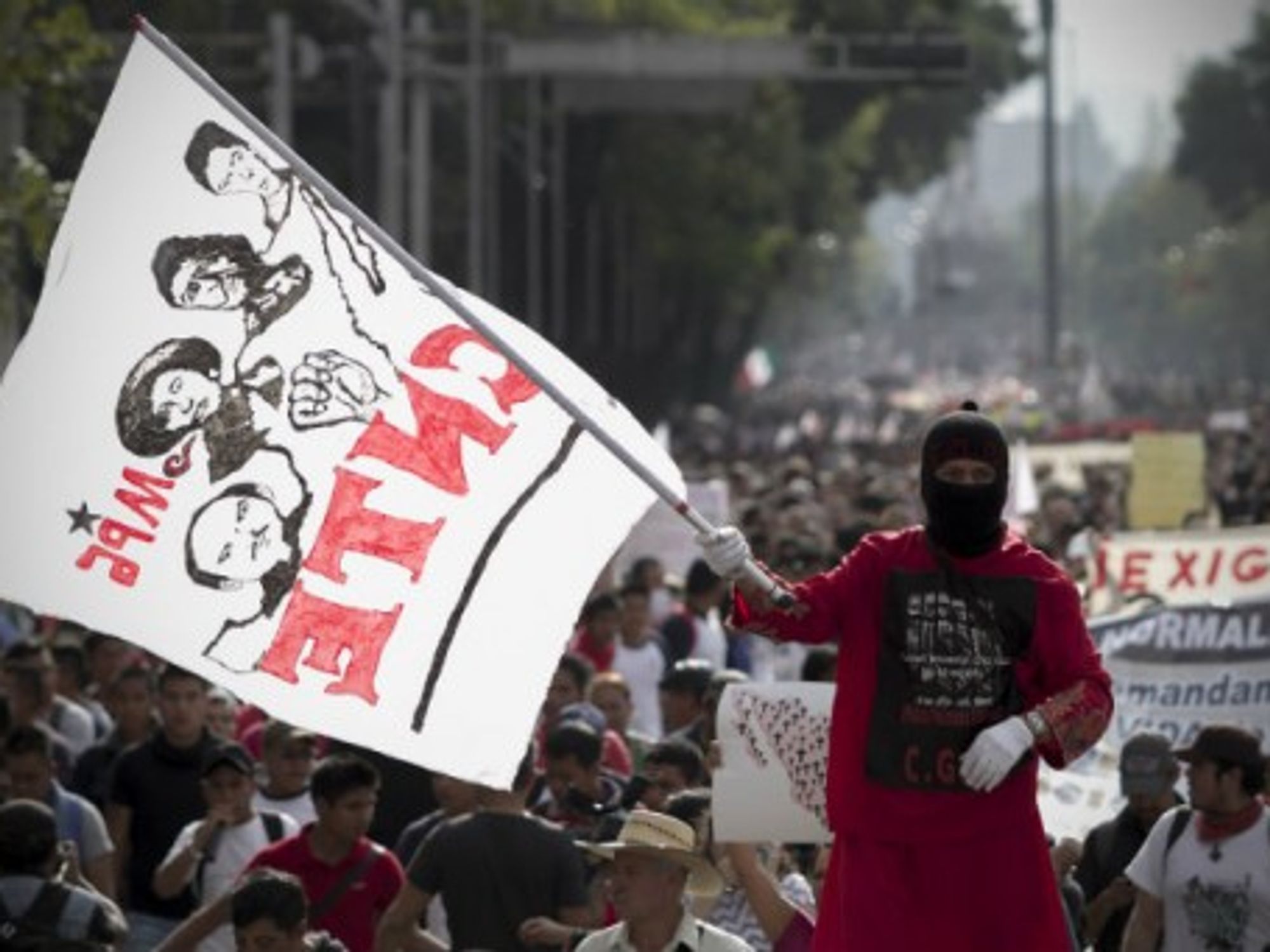 At a protest in Mexico City following news of the missing teens.