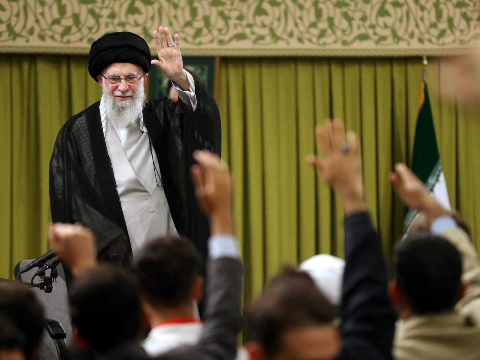 Ayatollah Ali Khamenei greets students during a Tehran meeting