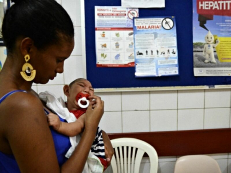 Baby suffering from microcephaly and his mother, in a hospital near Recife