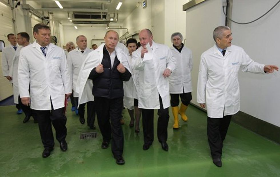 Back in chummier times, Vladimir Putin tours Yevgeny Prigozhin's food production plant.