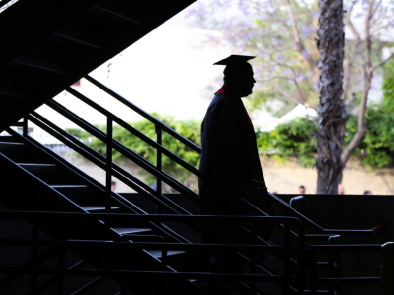 Backlit photo of a graduate at California State University