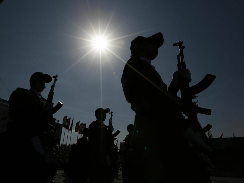 Backlit photo of Iranian soldiers marching in Tehran on October 3, 2021