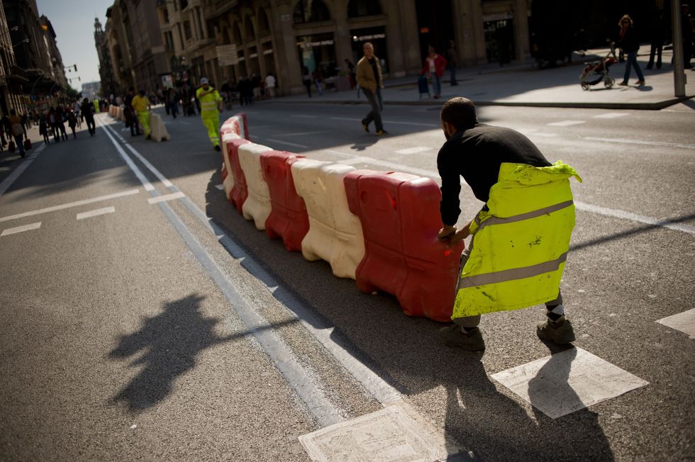 Barcelona city workers block off the street for European Mobility Week.