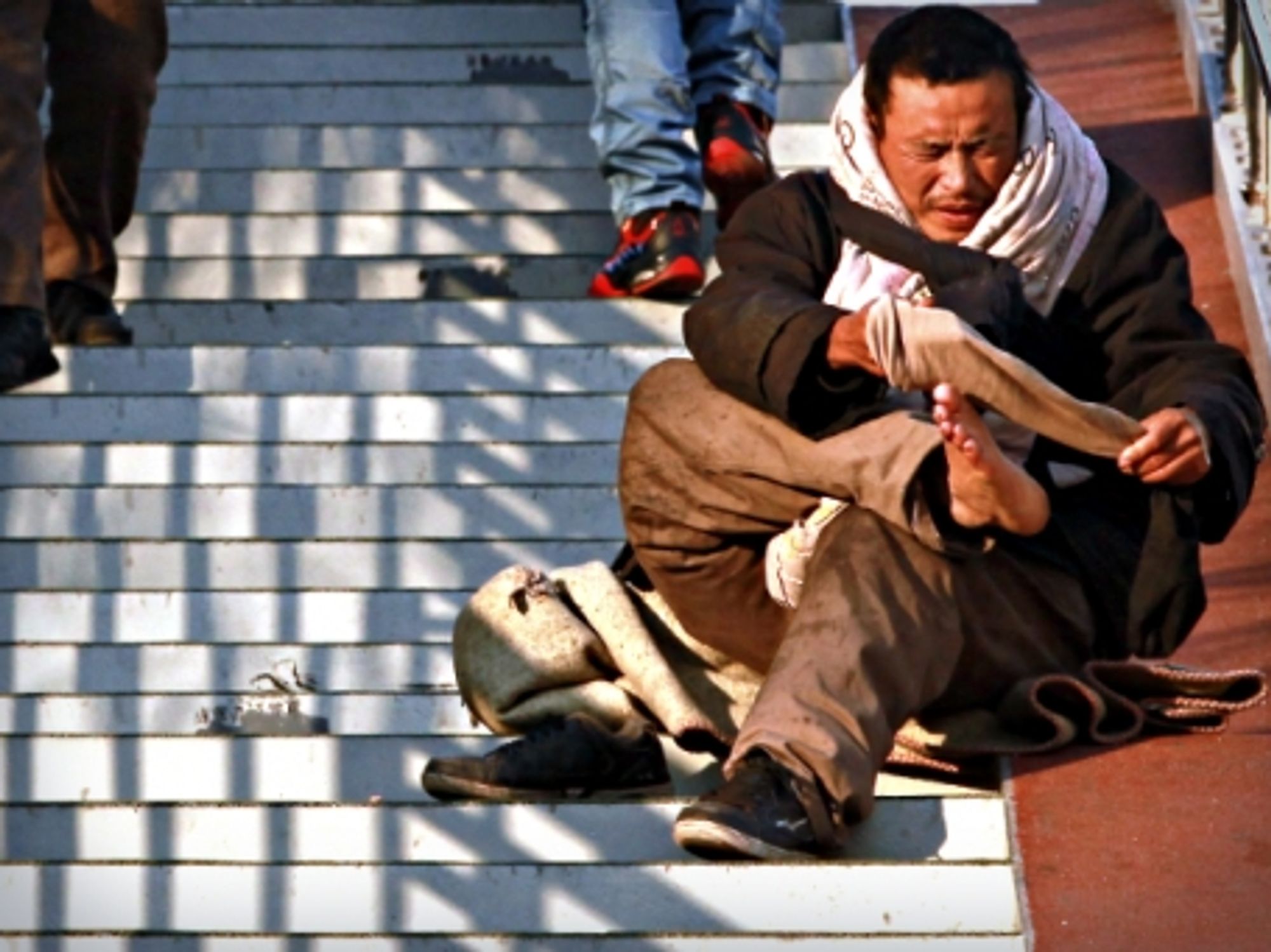 Beggar in Beijing, China