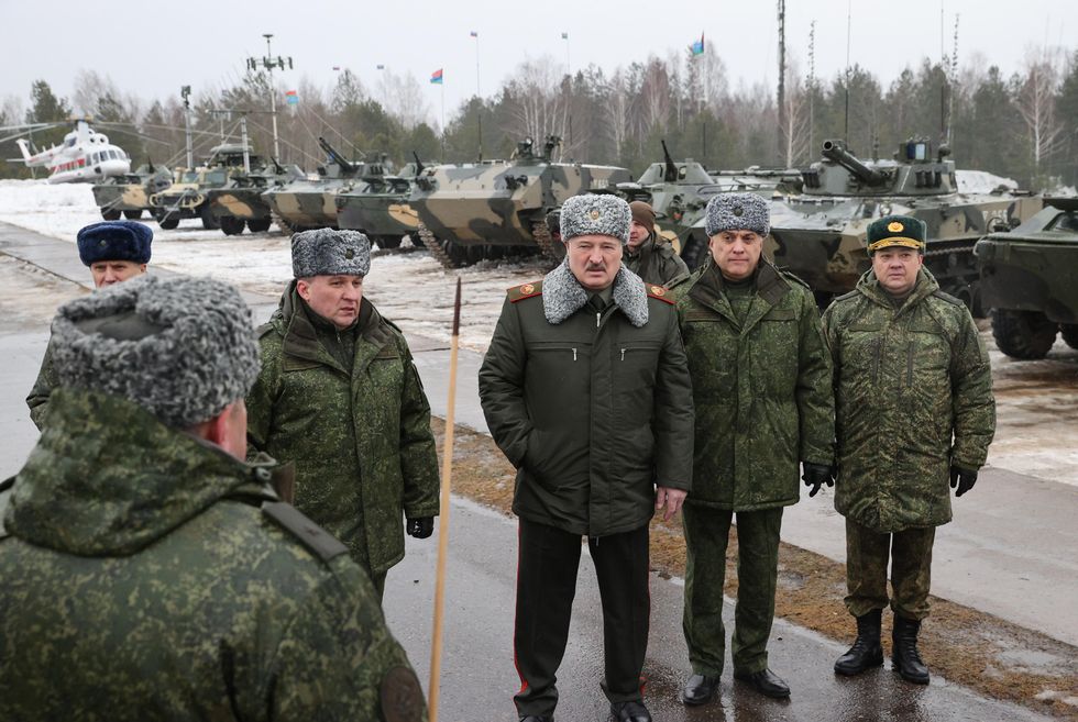 Belarus President Alexander Lukashenko in front of tanks