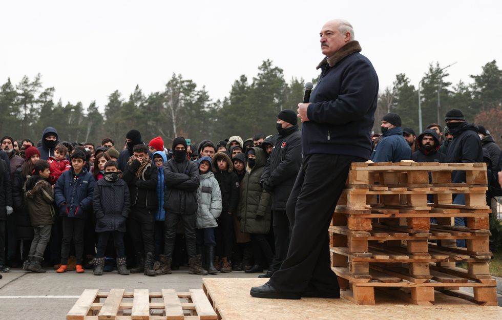 Belarus President Alexander Lukashenko talks to migrants at the Belarusian-Polish border.