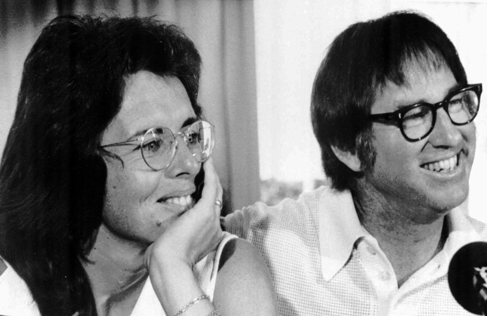 Billie Jean King and Bobby Riggs smiling during a news conference in New York to publicize their upcoming match at the Houston Astrodome, July 11, 1973.