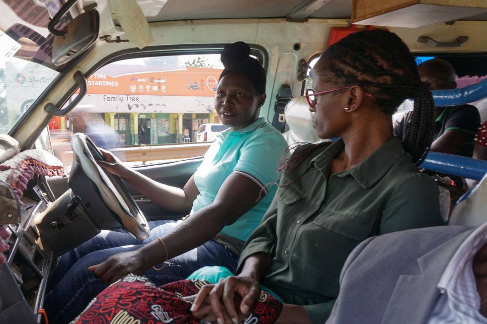 Birabwa Hajara and her woman colleague in a car.
