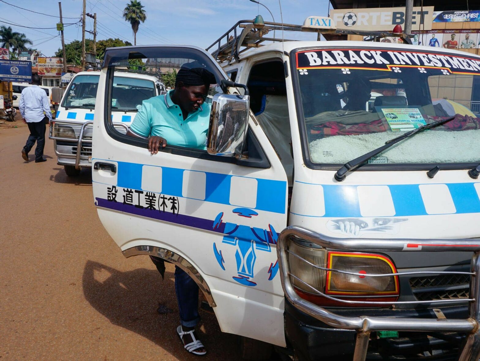 Birabwa Hajara takes the driver’s seat in a minivan at Kibuye Taxi Park on Entebbe Road in Kampala.