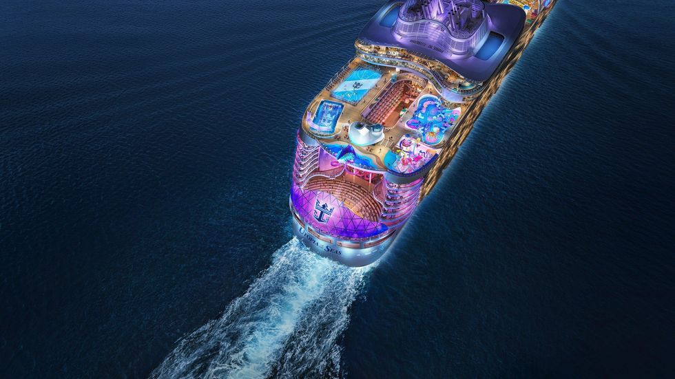 Bird's eye view of the Utopia of the Seas cruise ship sailing away