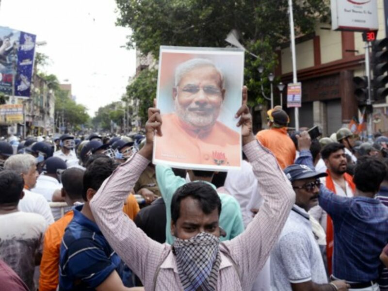 BJP activist hold Prime Minister Modi picture during BJP Lalabazar