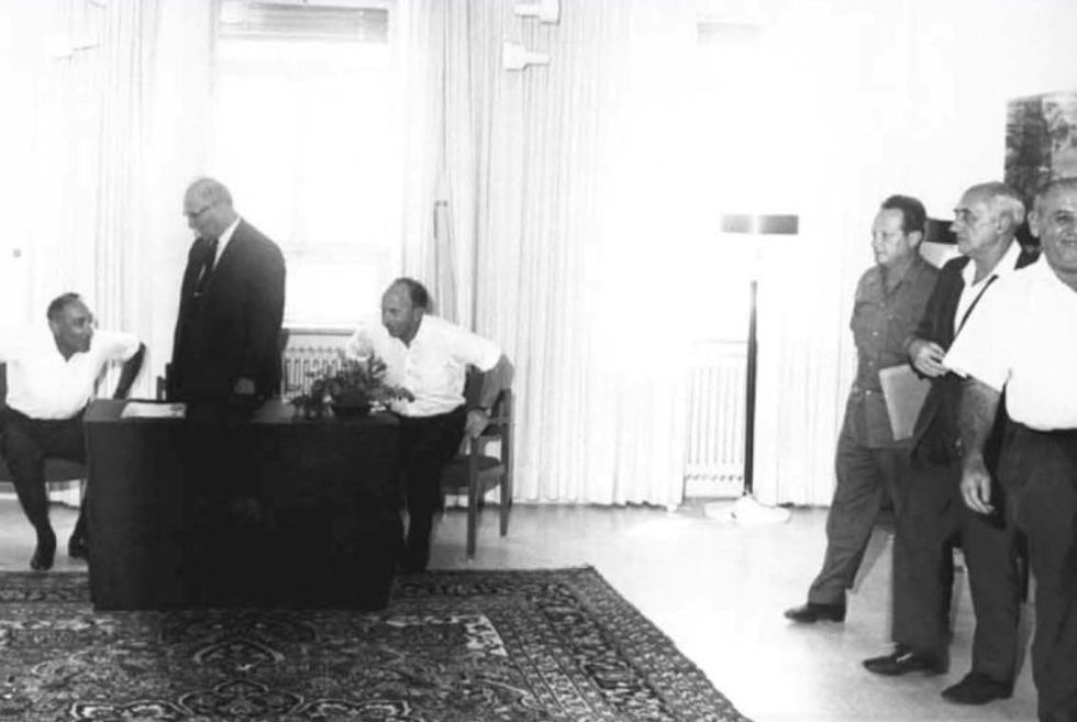 Black-and-white archive photo of a ​"change of command" ceremony of the Mossad in 1968