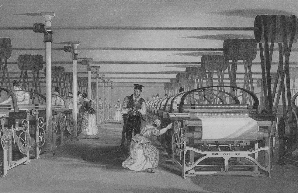 Black-and-white engraving of power loom weaving