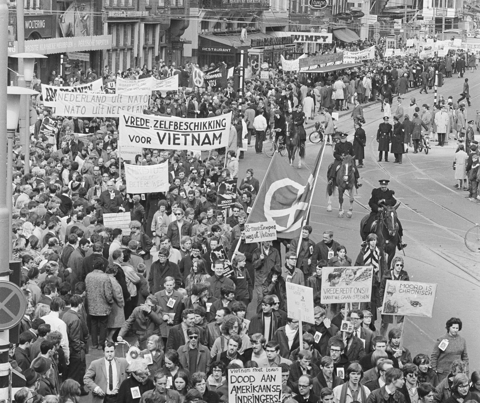 Black and white photo of a ​mass anti Vietnam war demonstration in Amsterdam on April 13, 1968