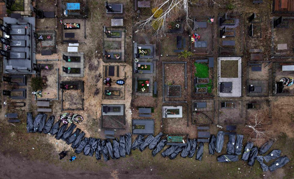 Body bags of people recovered from a mass grave in Bucha