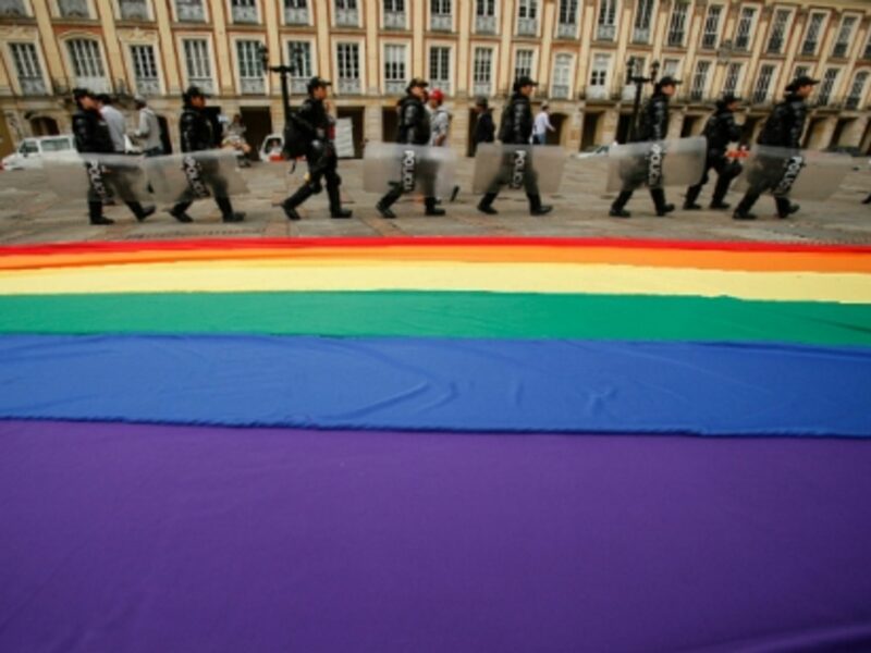 Bogota police officers stand guard outside the Colombian Congress, where lawmakers were voting on a proposed bill to legalize same-sex marriage in the country, on April 23, 2013.