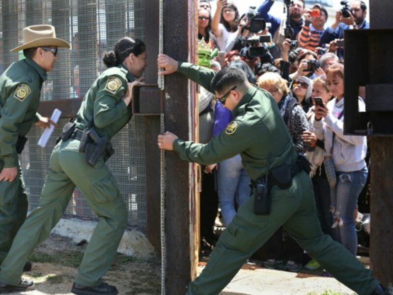 Border Patrol agents closing the Door of Hope between Tijuana and San Diego