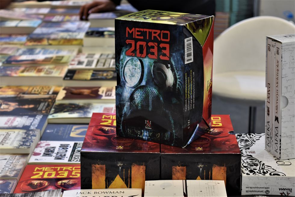 Box sets of the Metro 2033 series stacked at a book stand
