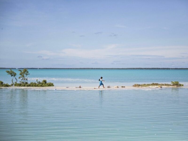 Boy walking to school in Aberao, Kiribati