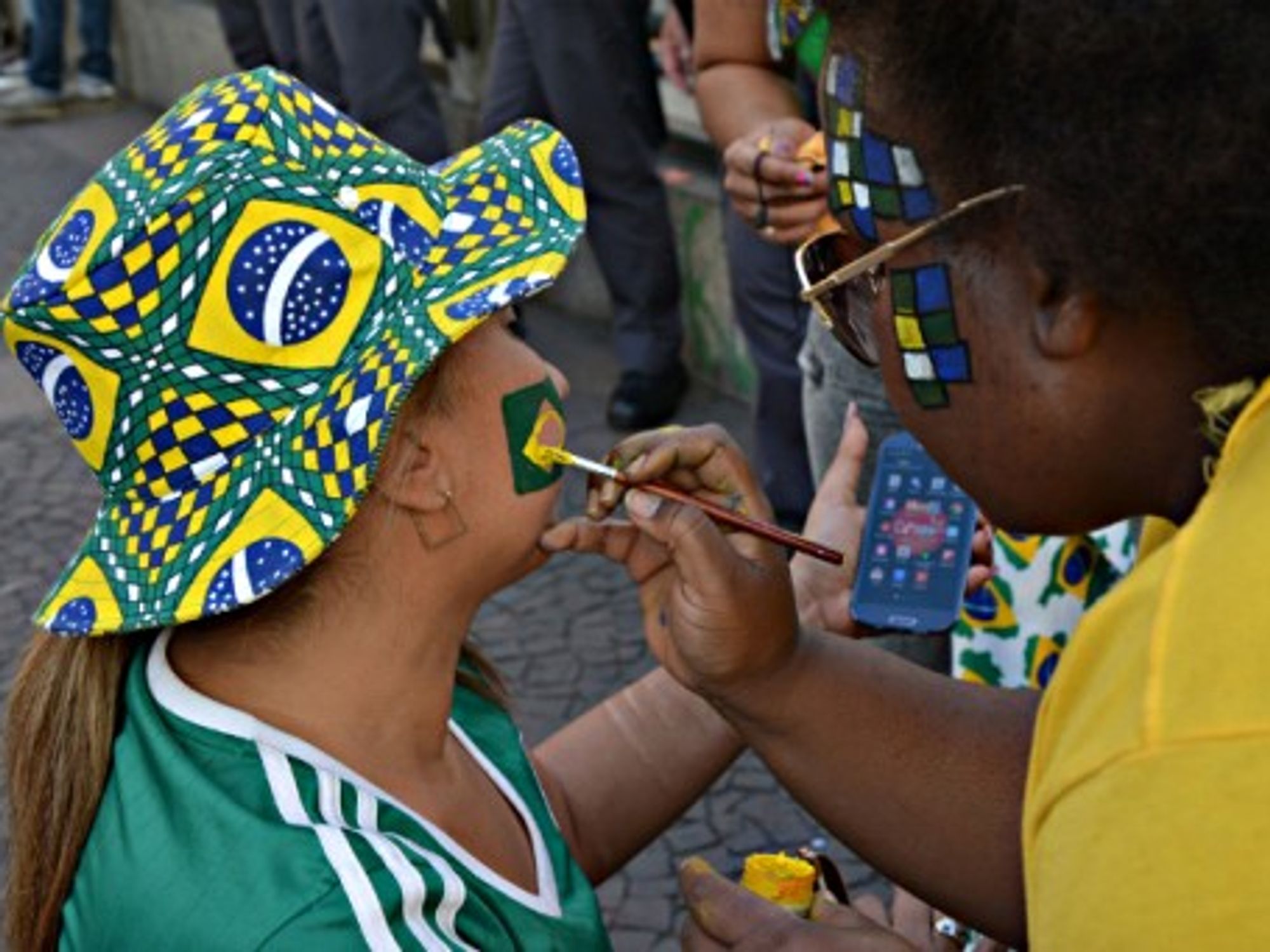Brazil fans watch the World Cup quarterfinal match between Brazil and Colombia in Sao Paulo, on July 4, 2014.