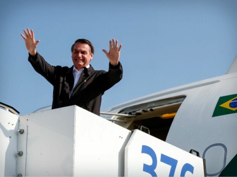 Brazil's President Jair Bolsonaro waving to the crowd as he leaves Israel
