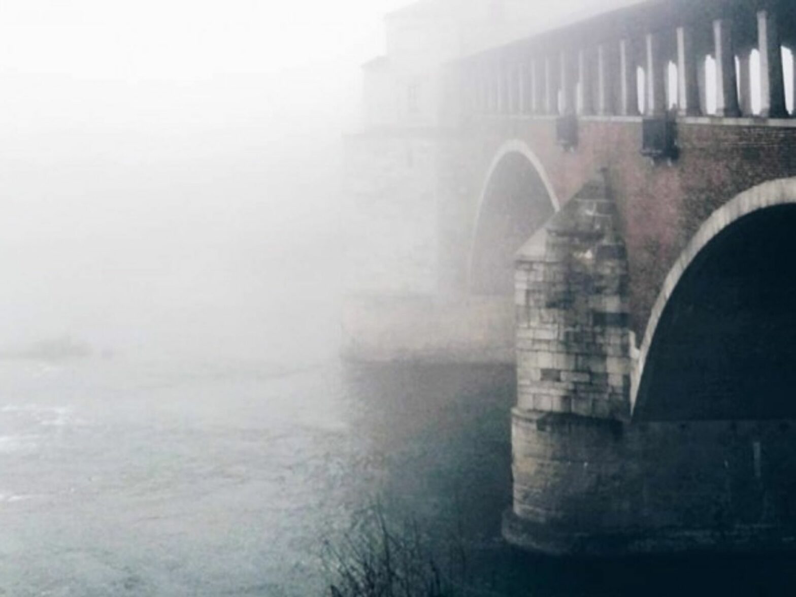 Bridge and river in Pavia, Italy.