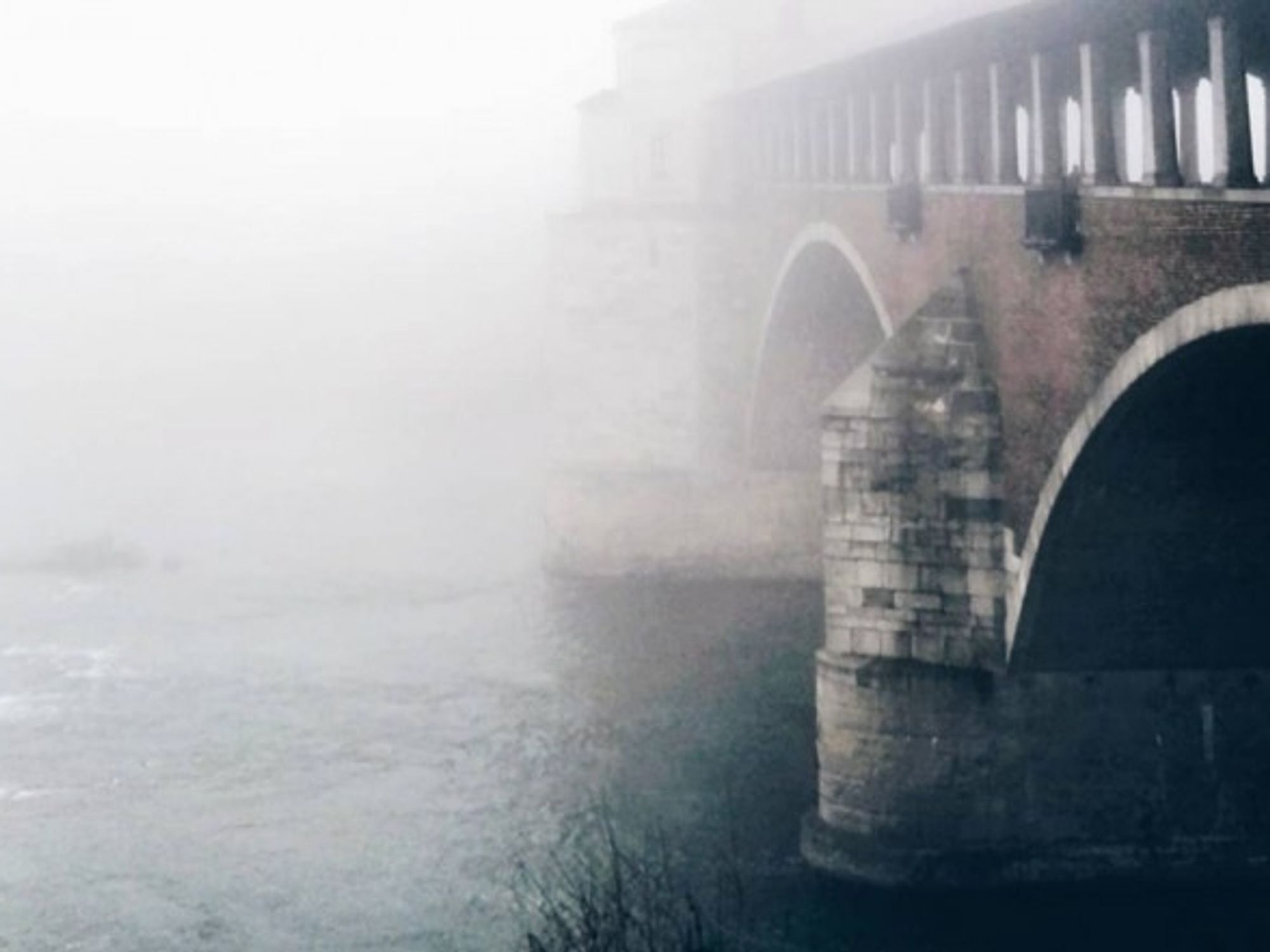 Bridge and river in Pavia, Italy.