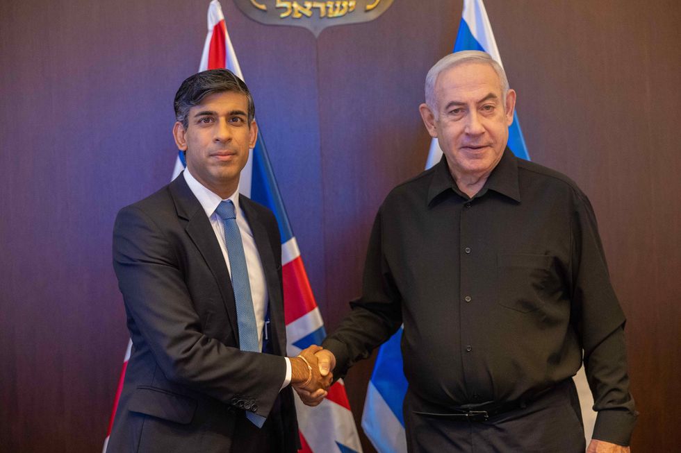 British Prime Minister Rishi Sunak, left, shakes hands with Israeli Prime Minister Benjamin Netanyahu, right, prior to a bilateral meeting on the Hamas attacks against Israel, October 18, 2023 in Jerusalem, Israel.