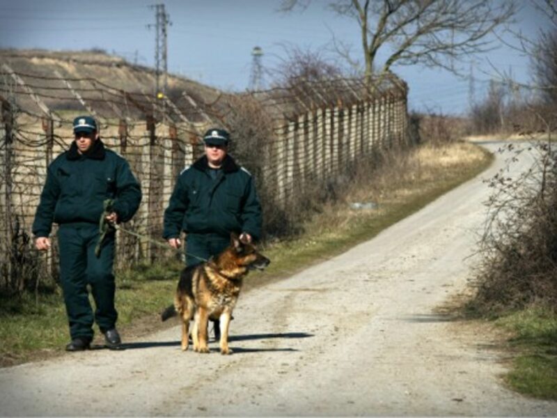 Bulgarian customs officers near the border fence between Bulgaria and Turkey