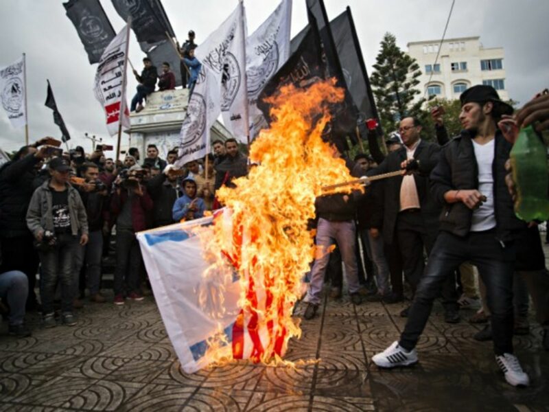 Burning American and Israeli flags in Gaza on Dec. 6