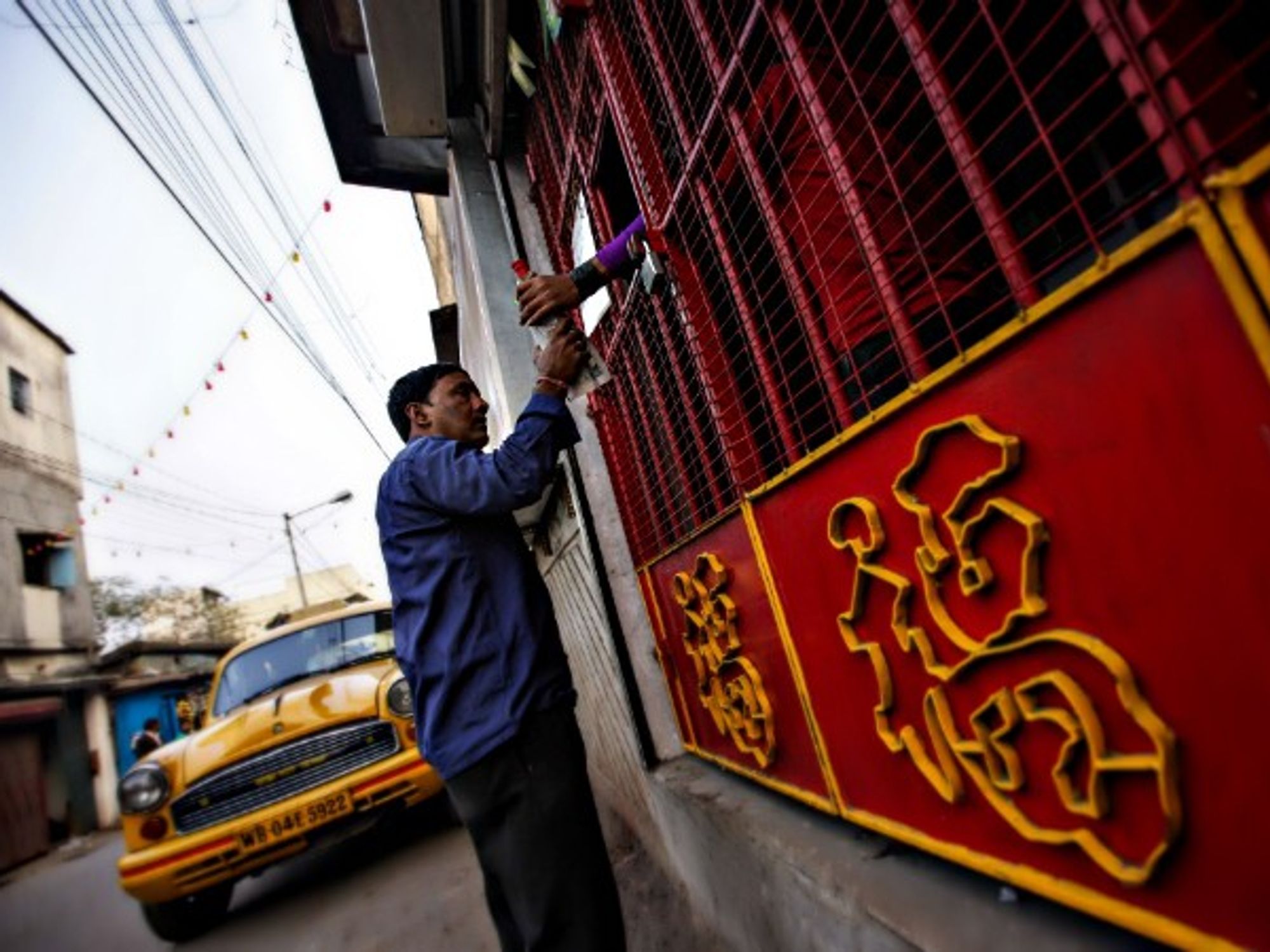 Buying liquor at a shop in Kolkata, India