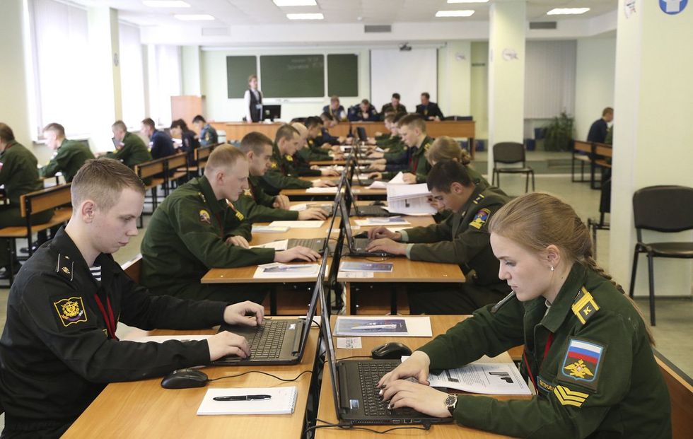 Cadets part of the Military Institute of the Military Academy of Logistics practicing computer science.