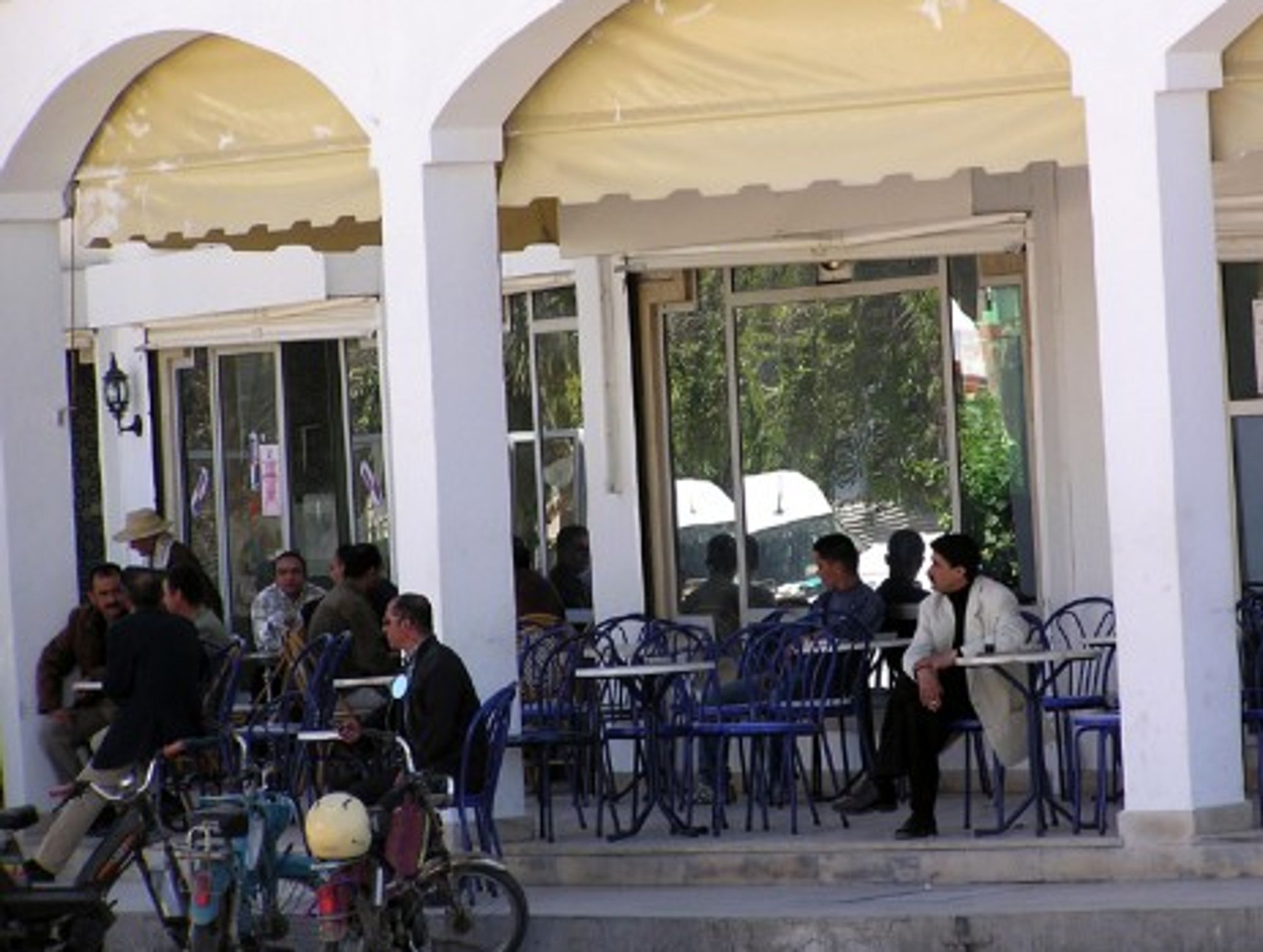 Cafe goers relaxing on the Tunisian ilsand of Djerba