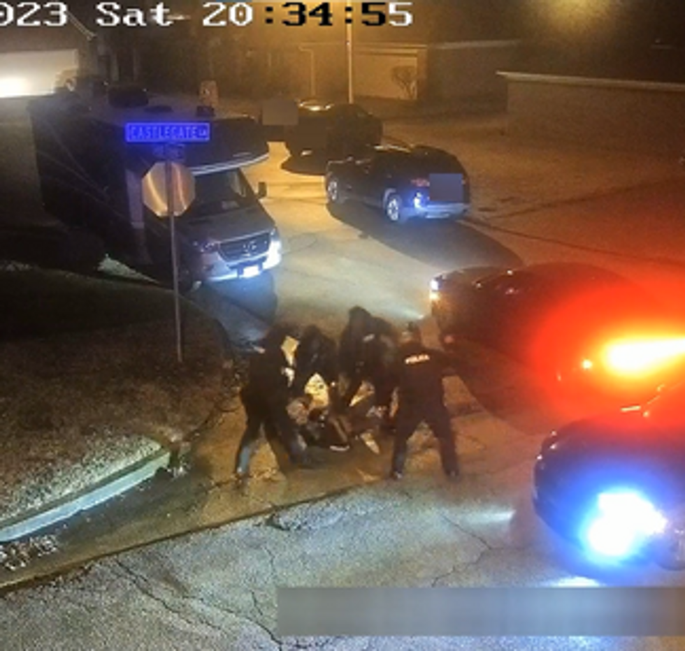 Camera footage of a man's altercation with police officers.
