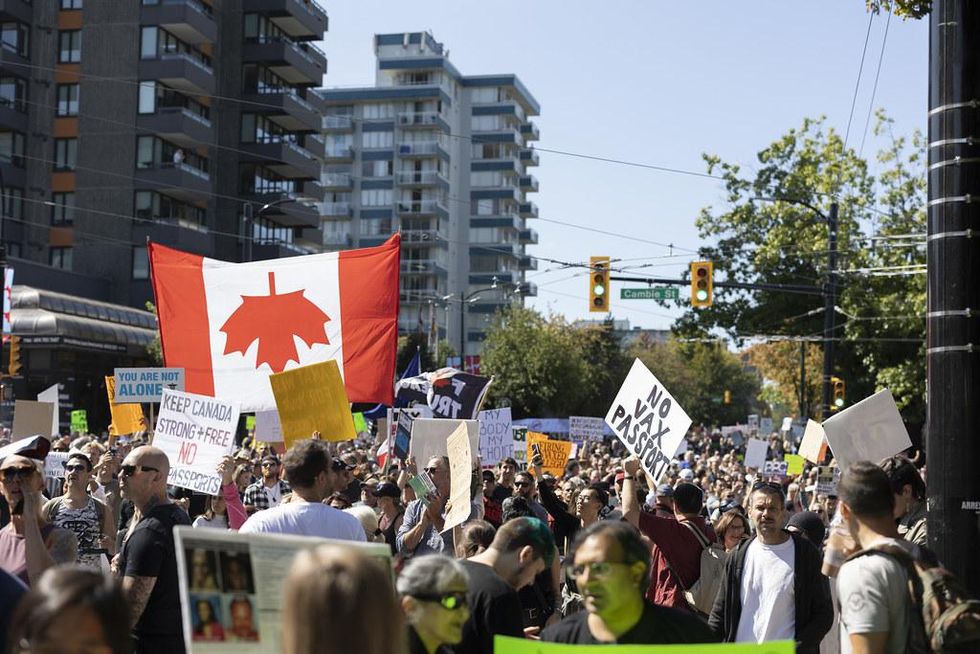 CANADA: Upside down flags + stars of David + hazmat suits