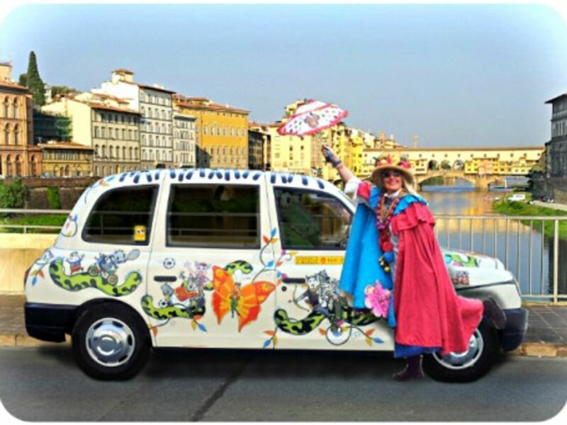 Caterina Bellandi and her "Milano 25" taxi in front of Florence's Ponte Vecchio