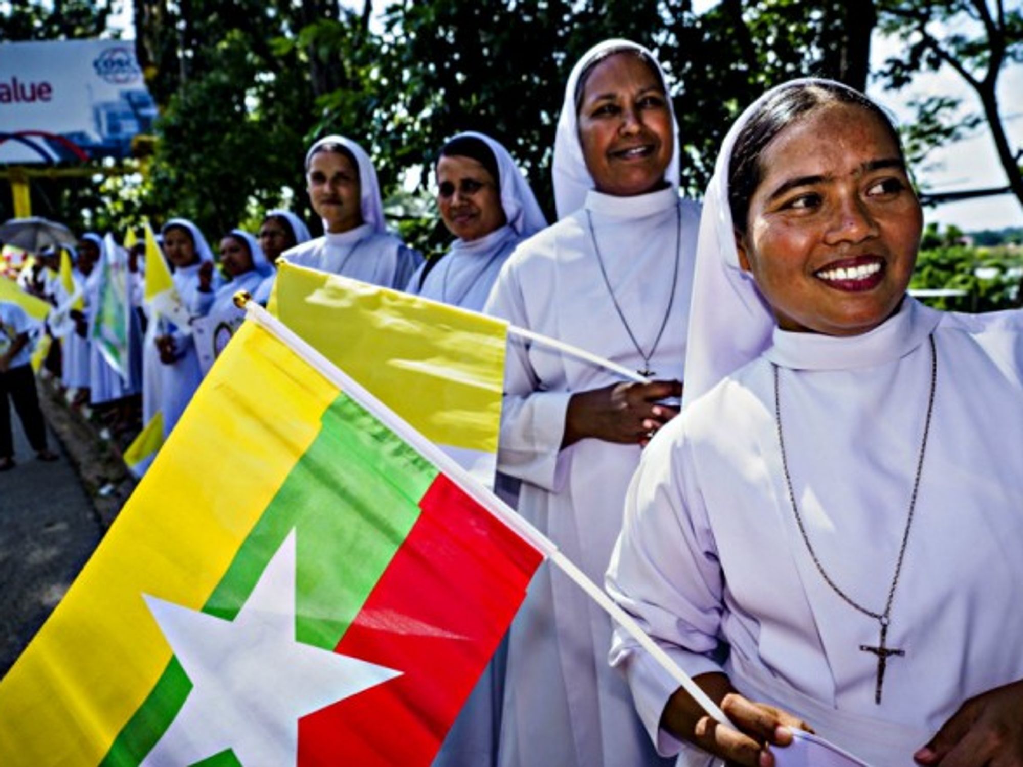 Catholic nuns await the arrival of Pope Francis in Rangoon