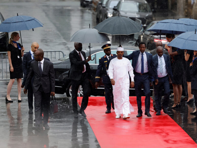 Chairman of the Transitional Military Council of Chad Mahamat Idriss Deby Itno (C) arrives at the Palais Brogniart for the New Global Financial Pact Summit in Paris, France.