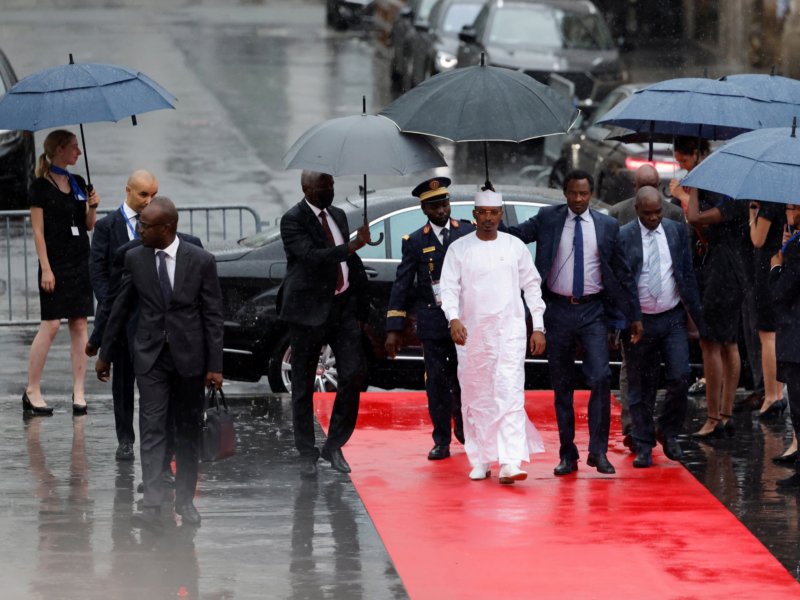 Chairman of the Transitional Military Council of Chad Mahamat Idriss Deby Itno (C) arrives at the Palais Brogniart for the New Global Financial Pact Summit in Paris, France.