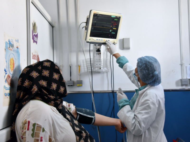 Checking a patient's blood pressure at a hospital in Tunis on May 11