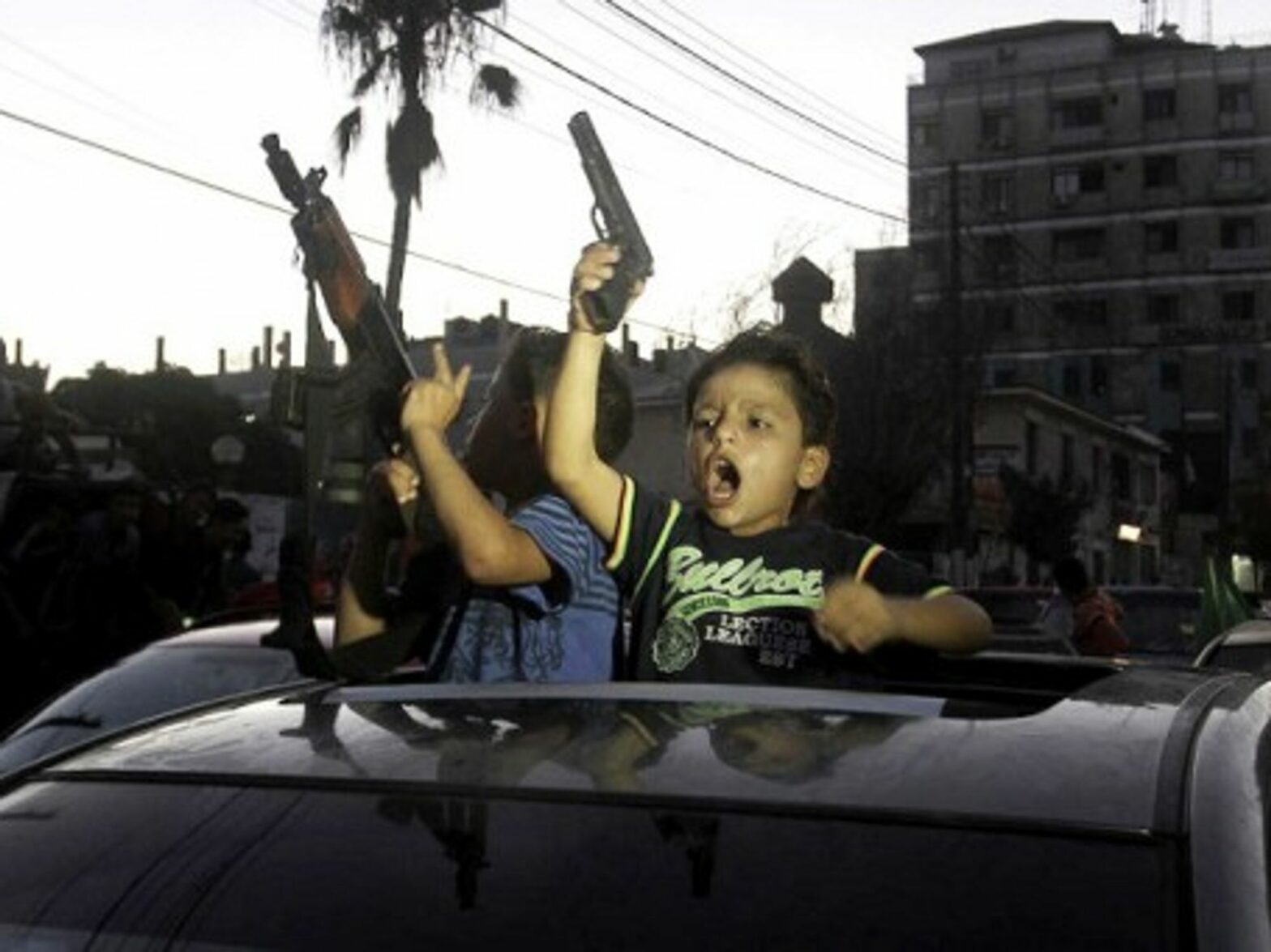 Children celebrating the open-ended ceasefire in Gaza.