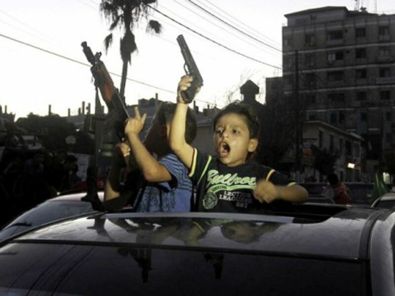 Children celebrating the open-ended ceasefire in Gaza.