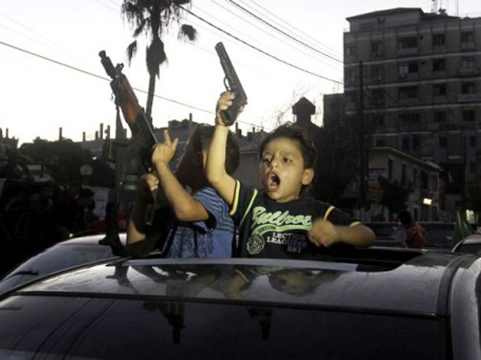 Children celebrating the open-ended ceasefire in Gaza.
