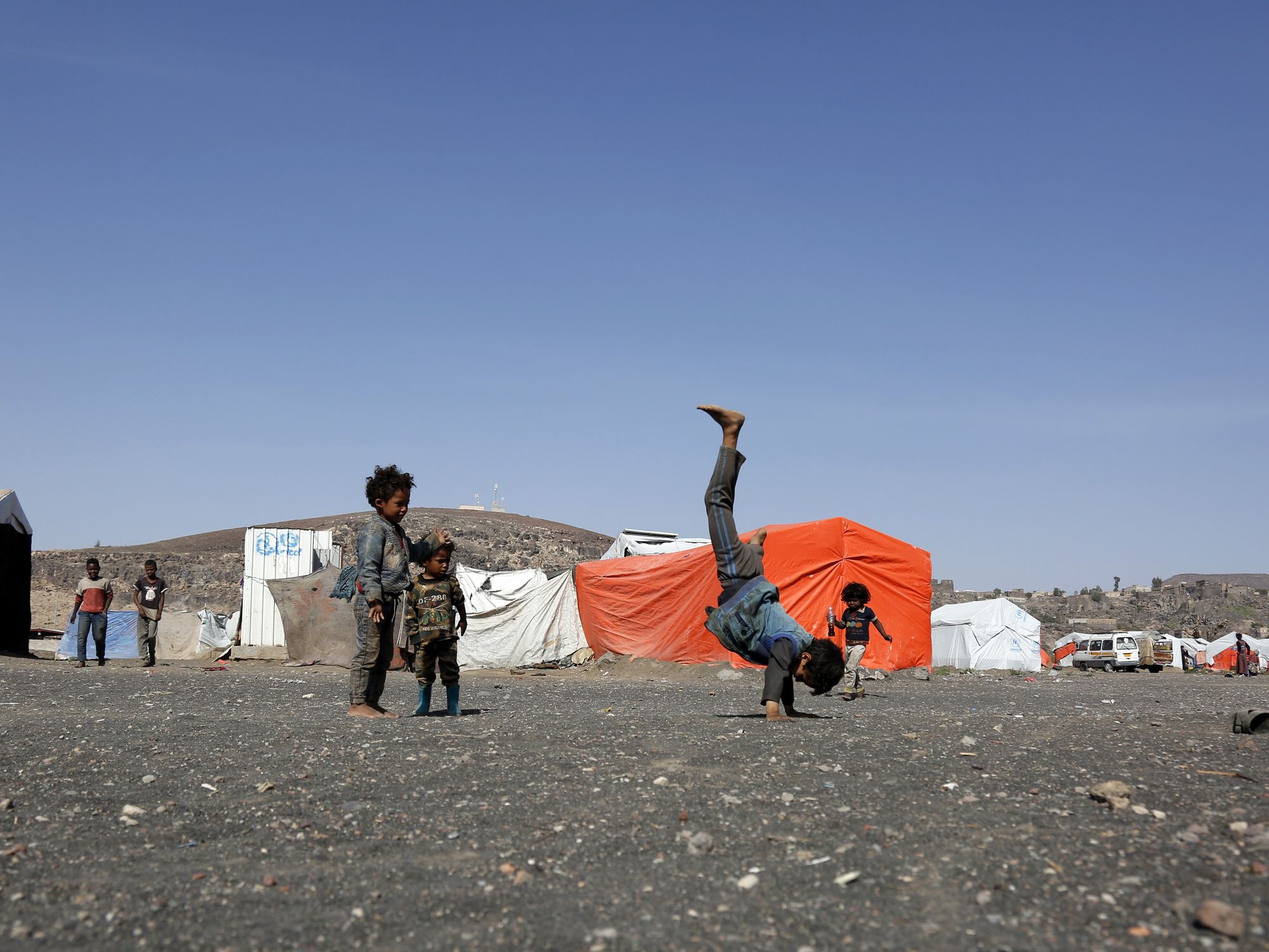 Children play at the Dharawan camp for internally displaced persons (IDPs) near Sanaa, Yemen
