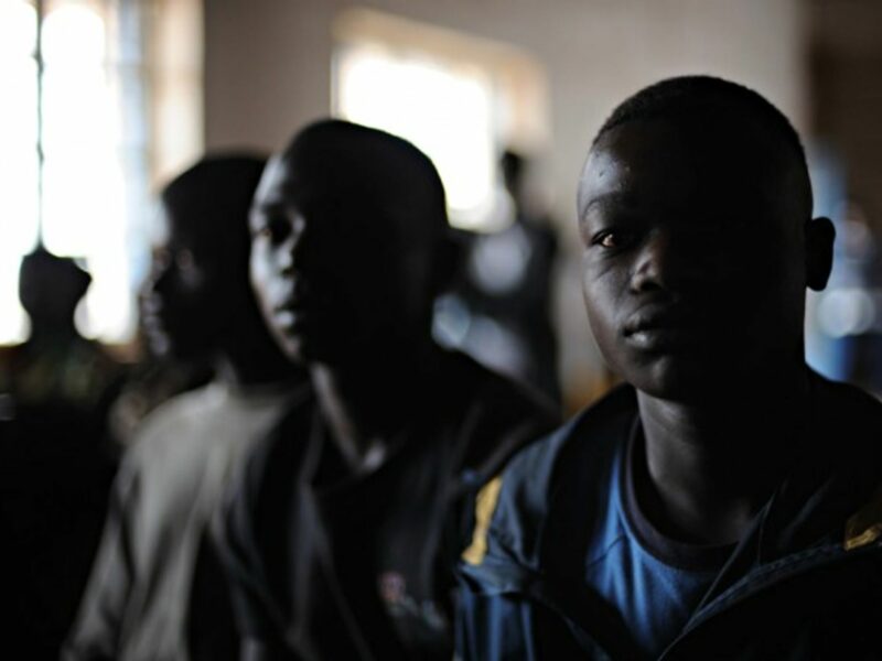 Children sit at a reintegration center in Kpandroma in 2009.
