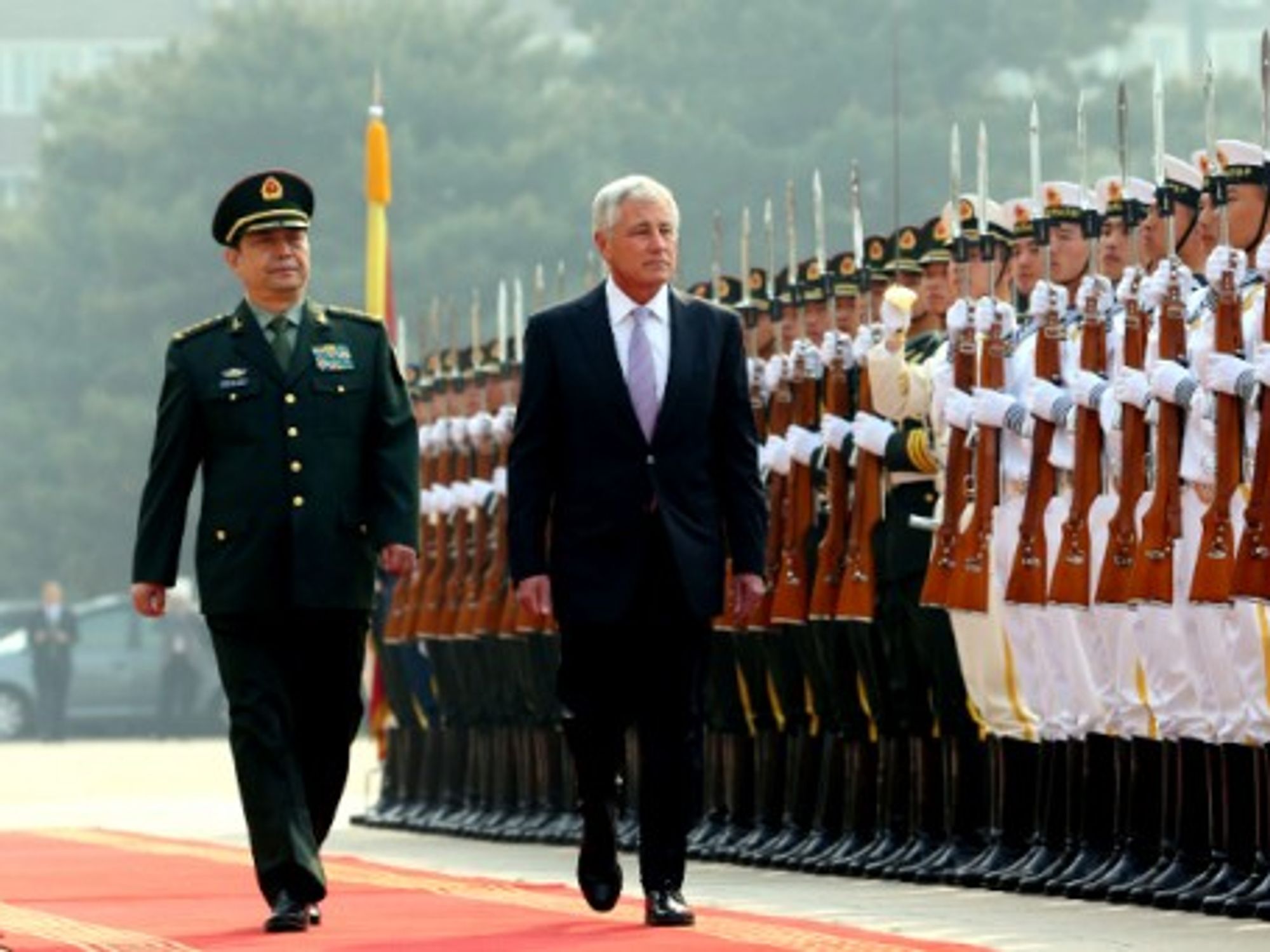 Chinese Defense Minister Chang Wanquan and U.S. Defense Secretary Chuck Hagel review the honor guard in Beijing