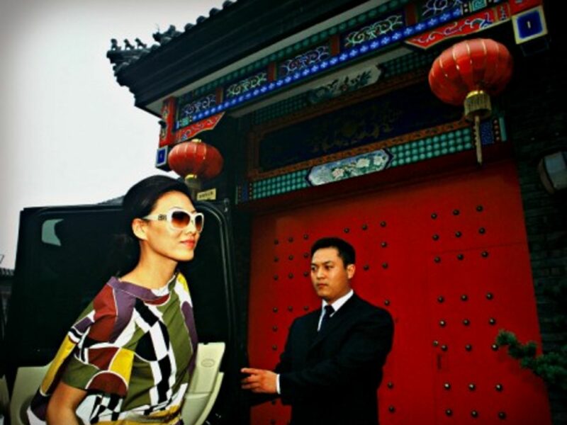 Chinese fashion shop owner Yuki Tan and her private chauffeur/bodyguard